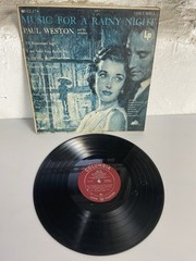 (1) 33 1/3 Rpm Album “ Music For A Rainy Night “ Paul Weston & Orchestra.