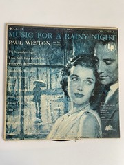 (1) 33 1/3 Rpm Album “ Music For A Rainy Night “ Paul Weston & Orchestra.