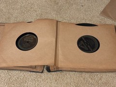 Lot of Nine (9) 78 rpm records in beautiful condition, in a book see list