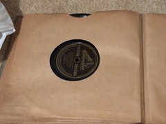 Lot of Nine (9) 78 rpm records in beautiful condition, in a book see list