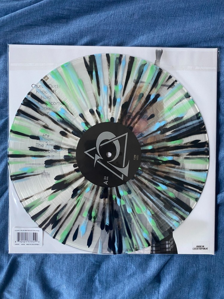 Poppy Zig Vinyl – Clear with Green, Black, and Baby Blue Splatter