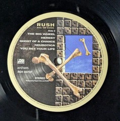 Rush – Roll The Bones (LP, Album, RE, RM, 180) (Mint (M)) – 4157654988