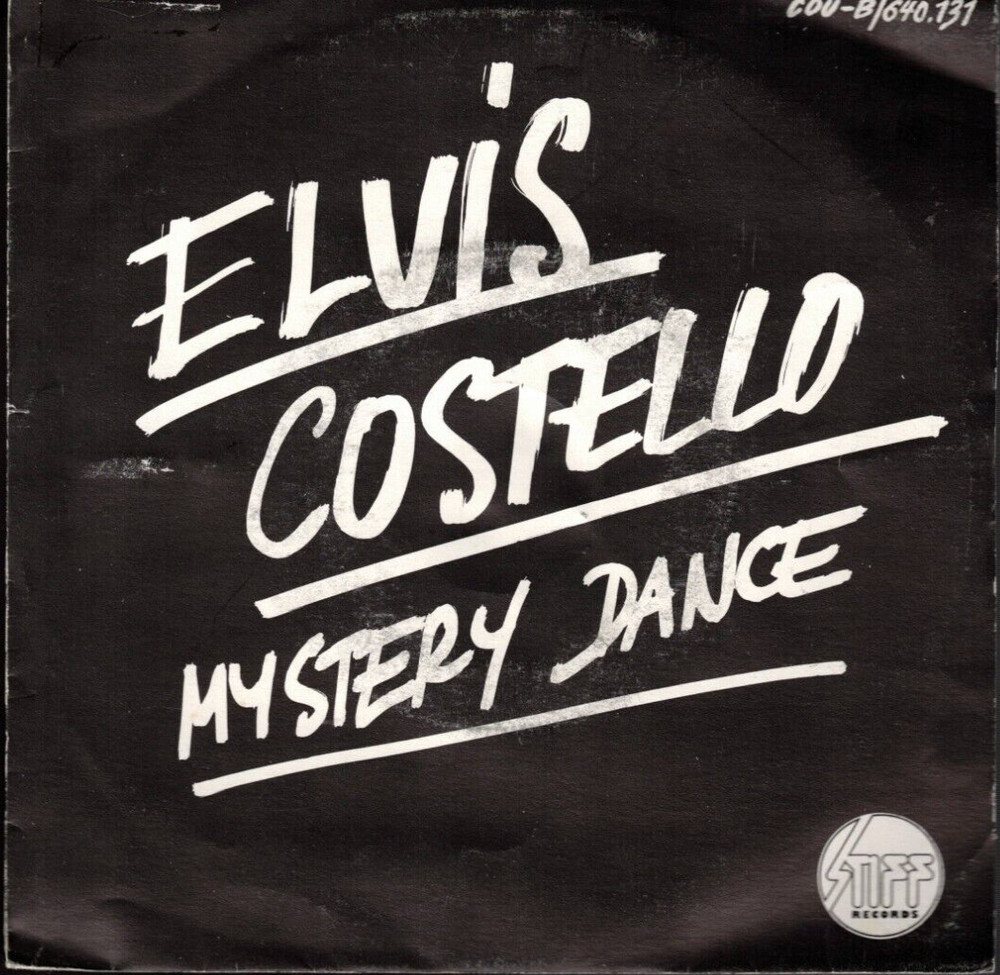 Mystery Dance by Elvis Costello (Orange 7″ Single, 1977, Stiff, PS) EX/VG+