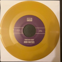John Waters – It’s In The Book (7″, Single, Gol) (Mint (M)) – 4201271640