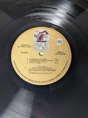 Brand X Do They Hurt? 1980 Passport Records LP Jazz Fusion Phil Collins Drums