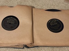 Lot of Nine (9) 78 rpm records in beautiful condition, in a book see list