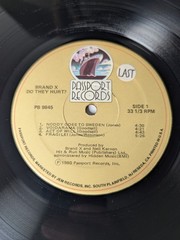 Brand X Do They Hurt? 1980 Passport Records LP Jazz Fusion Phil Collins Drums