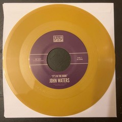 John Waters – It’s In The Book (7″, Single, Gol) (Mint (M)) – 4201271640